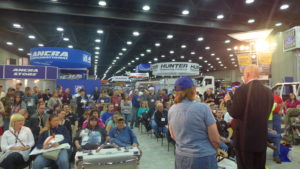 The Tough or Not Tough game show attracts throngs of people in the Ford exhibit.