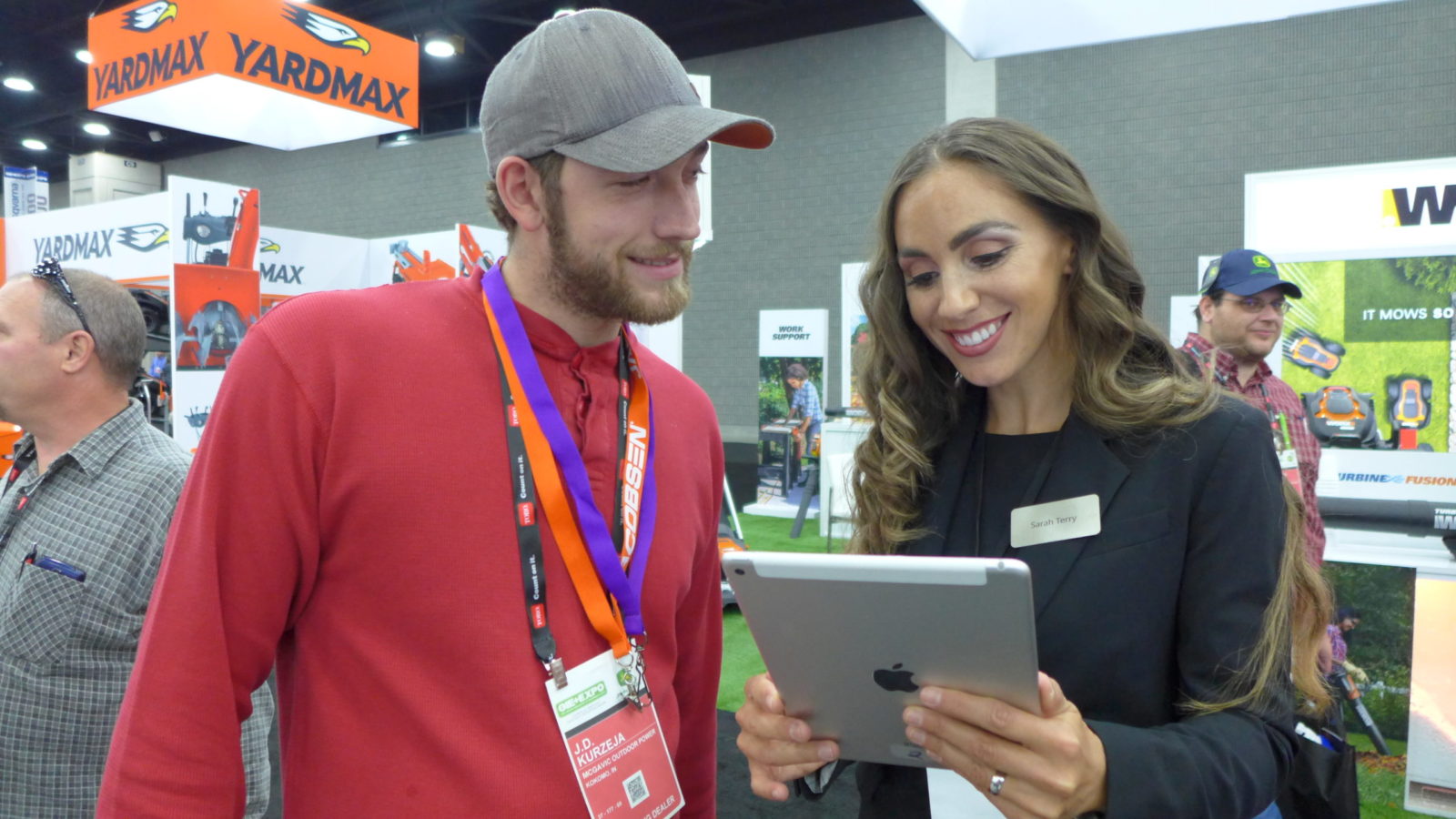 TPG Brand Ambassador greets a visitor and qualifies leads at GIE + Expo