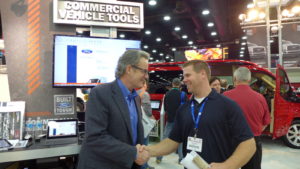 TPG Product Specialist, Peter, interacting with a visitor at the Mid American Trucking Show. 
