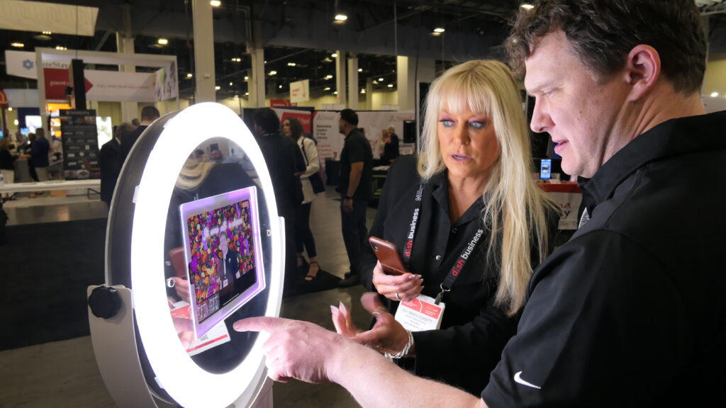 brand ambassador engaging in photo activation at a trade fair